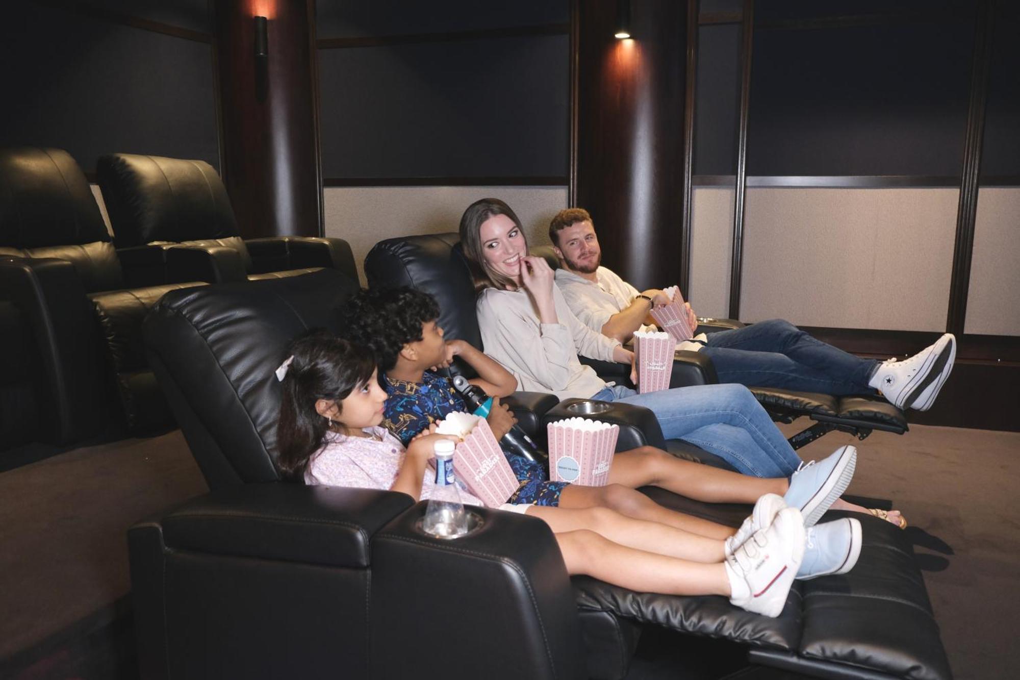 Charthouse Bahrain Hotel Manama Exterior photo A family watching a movie in a home theater
